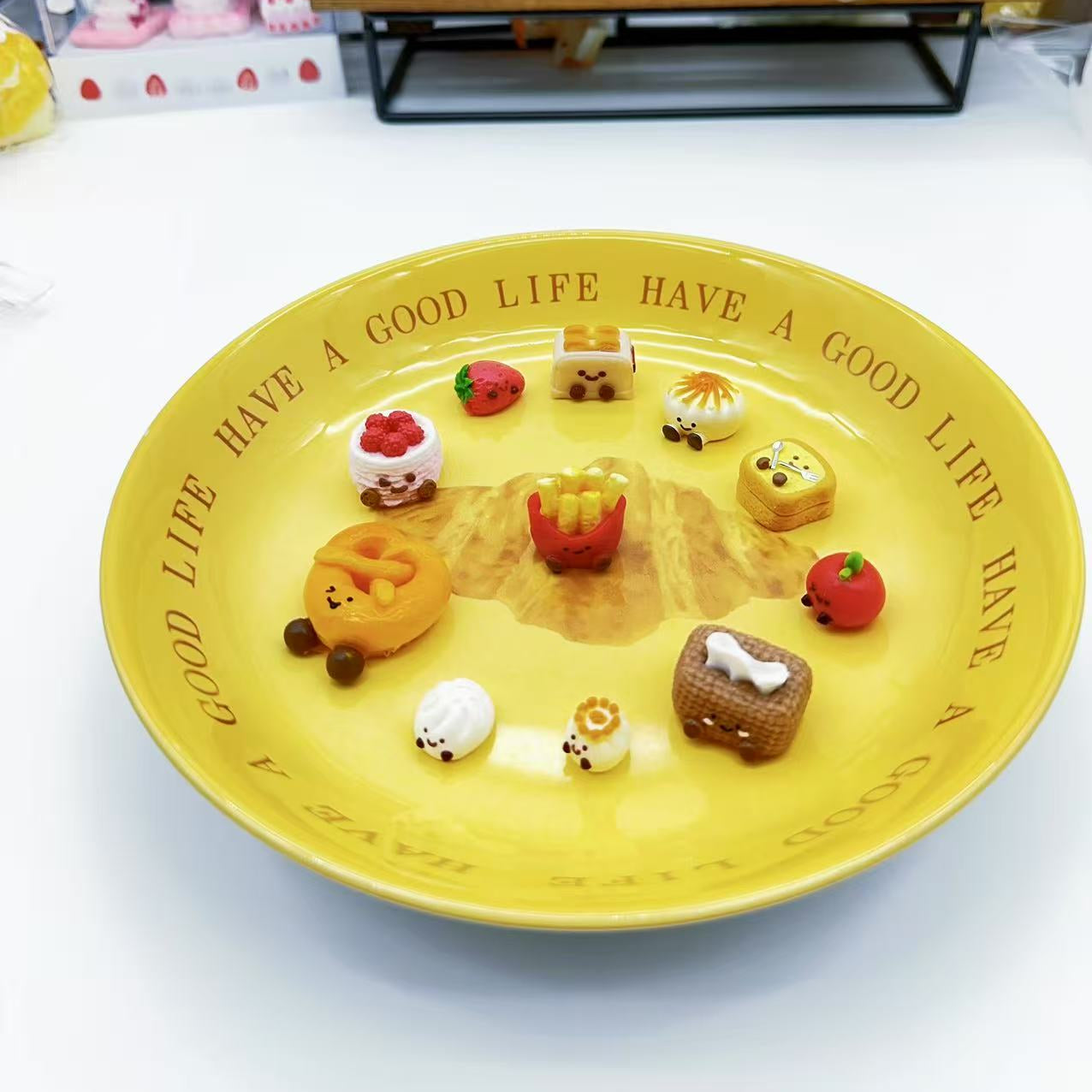 front view of 11-piece JellyCat Taba Squishy Set featuring mini food-shaped characters like tissue box, toaster, pretzel, and dimsum.