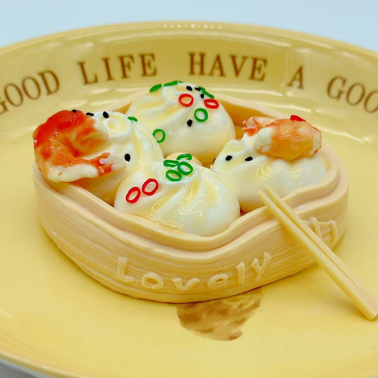 Dim sum shrimp squishy served on ceramic yellow plate, styled like gourmet food