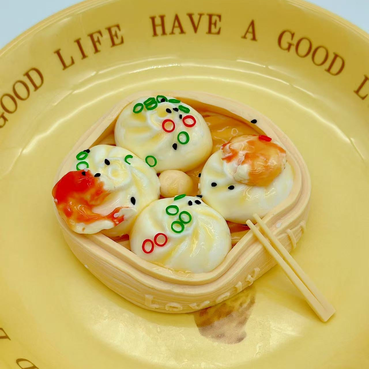 Dim sum shrimp squishy served on ceramic yellow plate, styled like gourmet food