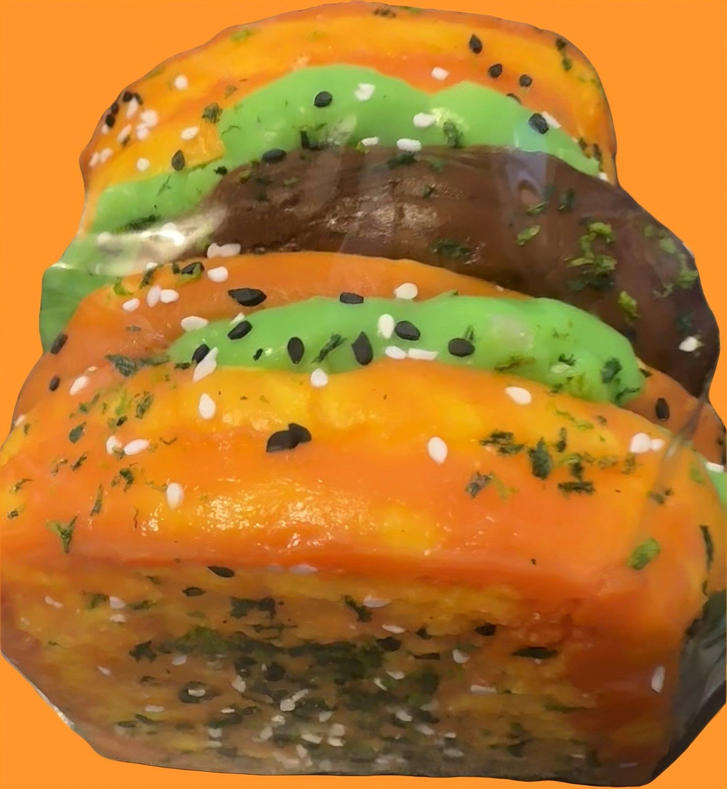Close-up of jumbo sandwich squishy toy with six layers of toppings including patty, lettuce, egg, cheese,and tomato