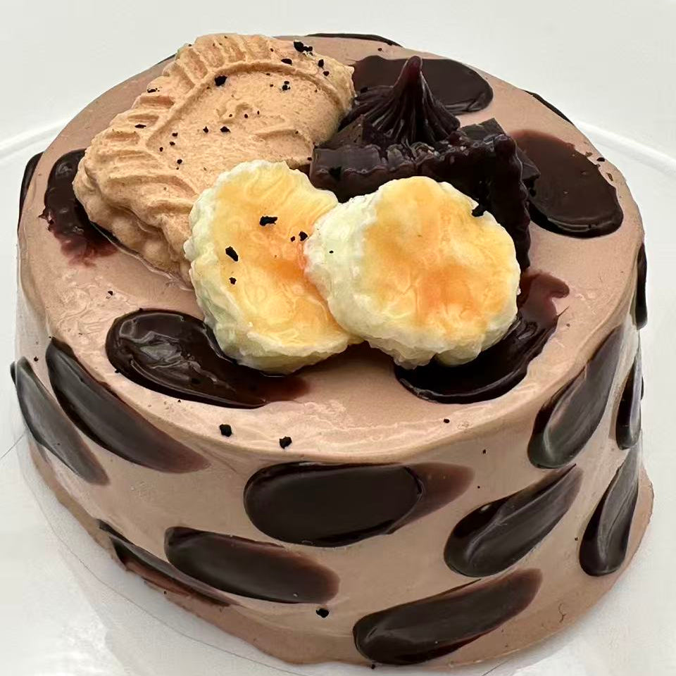 Chocolate Cream Dream Taba Squishy shown on a clean white background, featuring a realistic handmade chocolate cake design