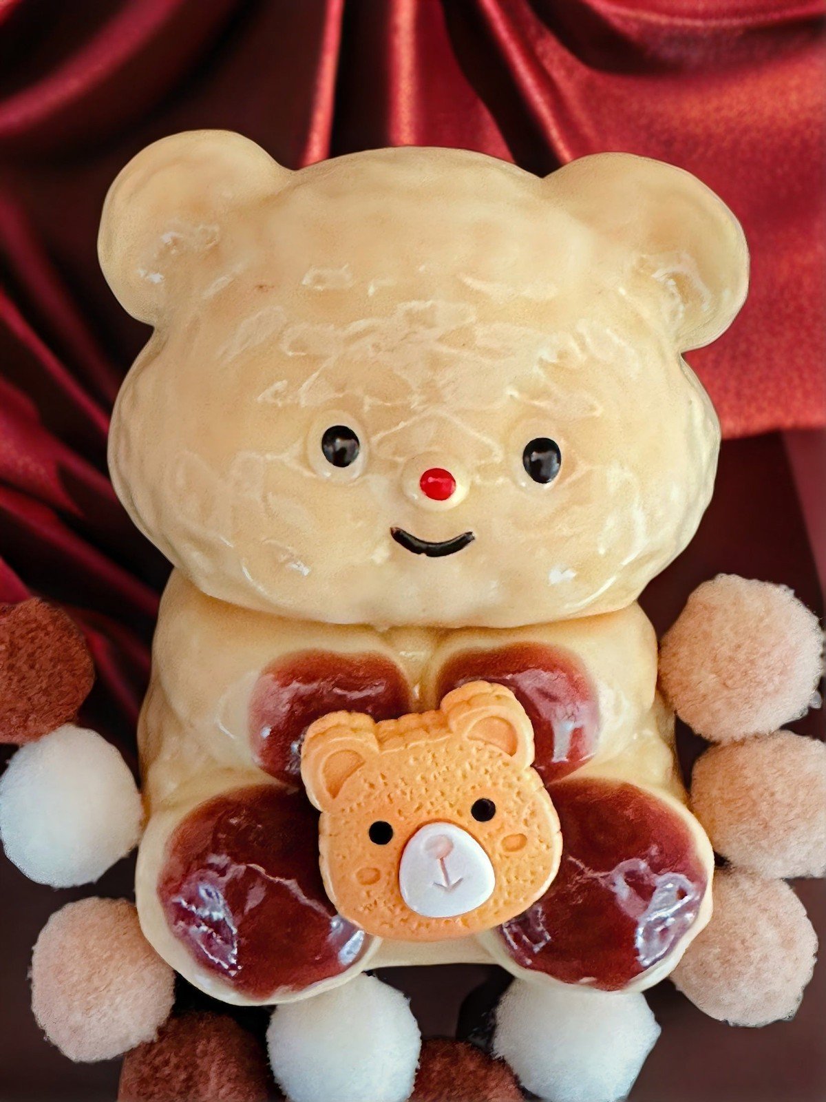 Front view of Honey Hug Bear squishy toy holding honey jar, with cute blushing bear face and soft textured design, perfect for stress relief and collection.