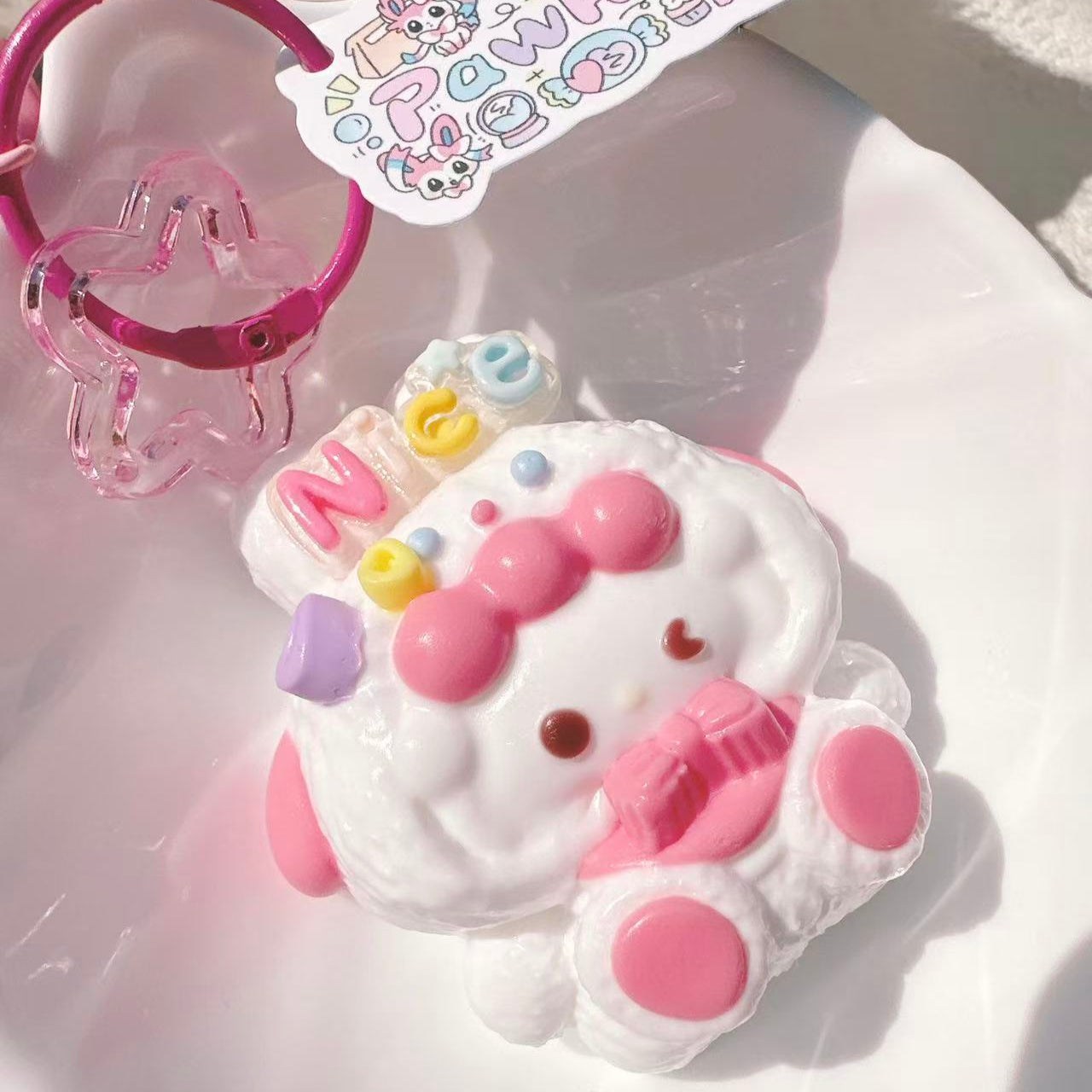 Handmade Sanrio Piano Taba Squishy, cute pink and white kawaii squishy toy for stress relief and collection.