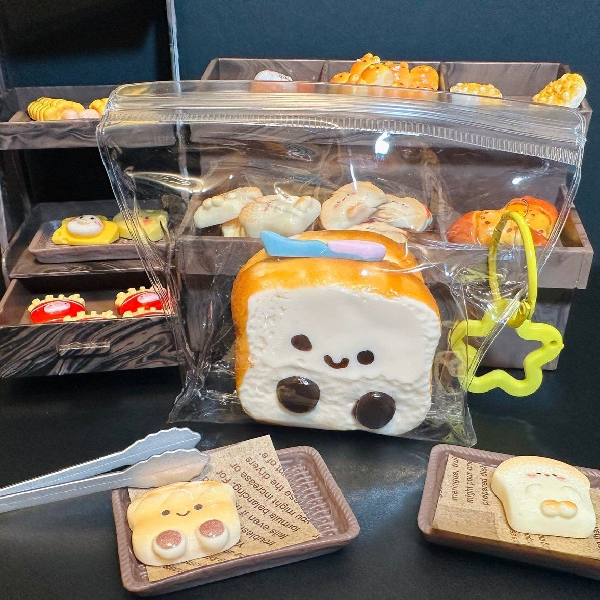 Adorable puppy toast squishy with accessories, styled in a miniature bakery scene with shelves and packaging