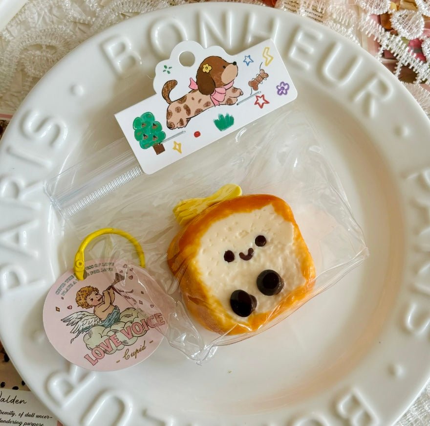 Close-up of puppy toast squishy on white Parisian plate, styled like a gourmet dessert