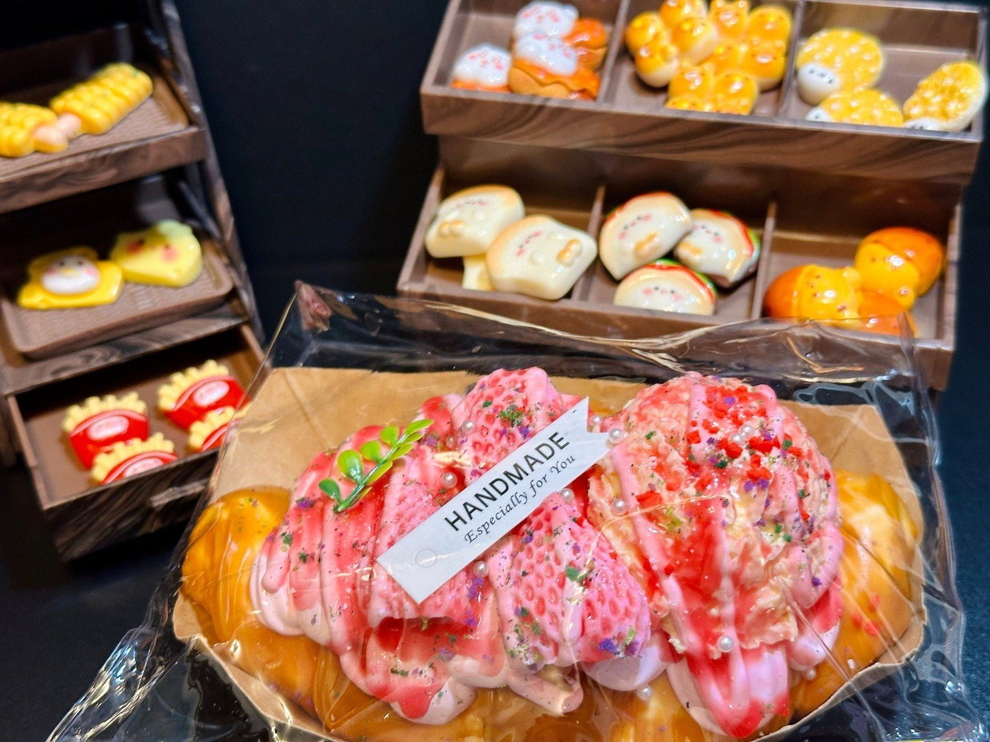 Rosé Royale Croissant Squishy displayed with strawberry icecream