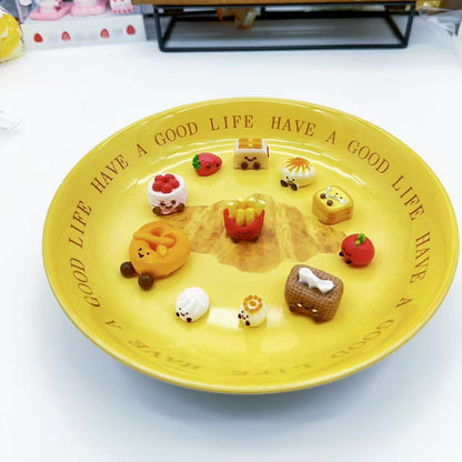 front view of 11-piece JellyCat Taba Squishy Set featuring mini food-shaped characters like tissue box, toaster, pretzel, and dimsum.