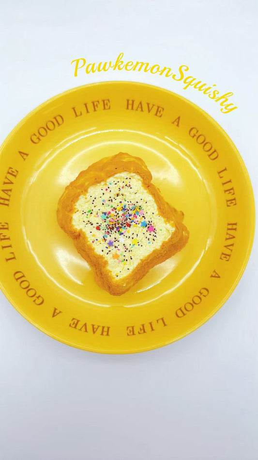 Front view of the 2-layer Jumbo Toast Squishy with whipped cream top and colorful sprinkles.