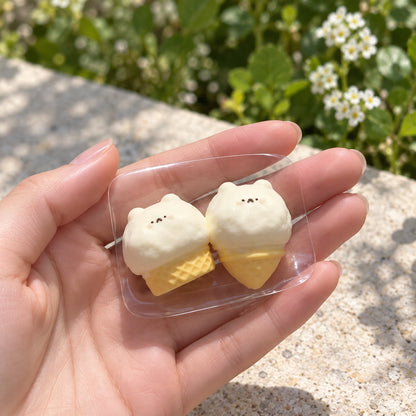 Two-piece mini hamster ice cream Taba squishy set in a clear PVC display bag with beige trim, photographed from above on a white plate.