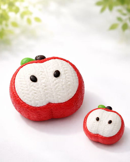 2-piece knitted apple taba squishy set, handmade silicone squishy toys with red and white apple design, soft texture, cozy style, clean product photography