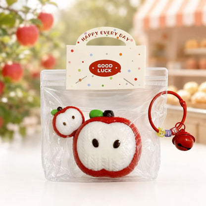 2pc Knitted Apple Taba Squishy by Pawkemon Squishy, a handmade silicone apple squishy set with knitted-style texture, red apple slice design, clear packaging, and red bell charm.