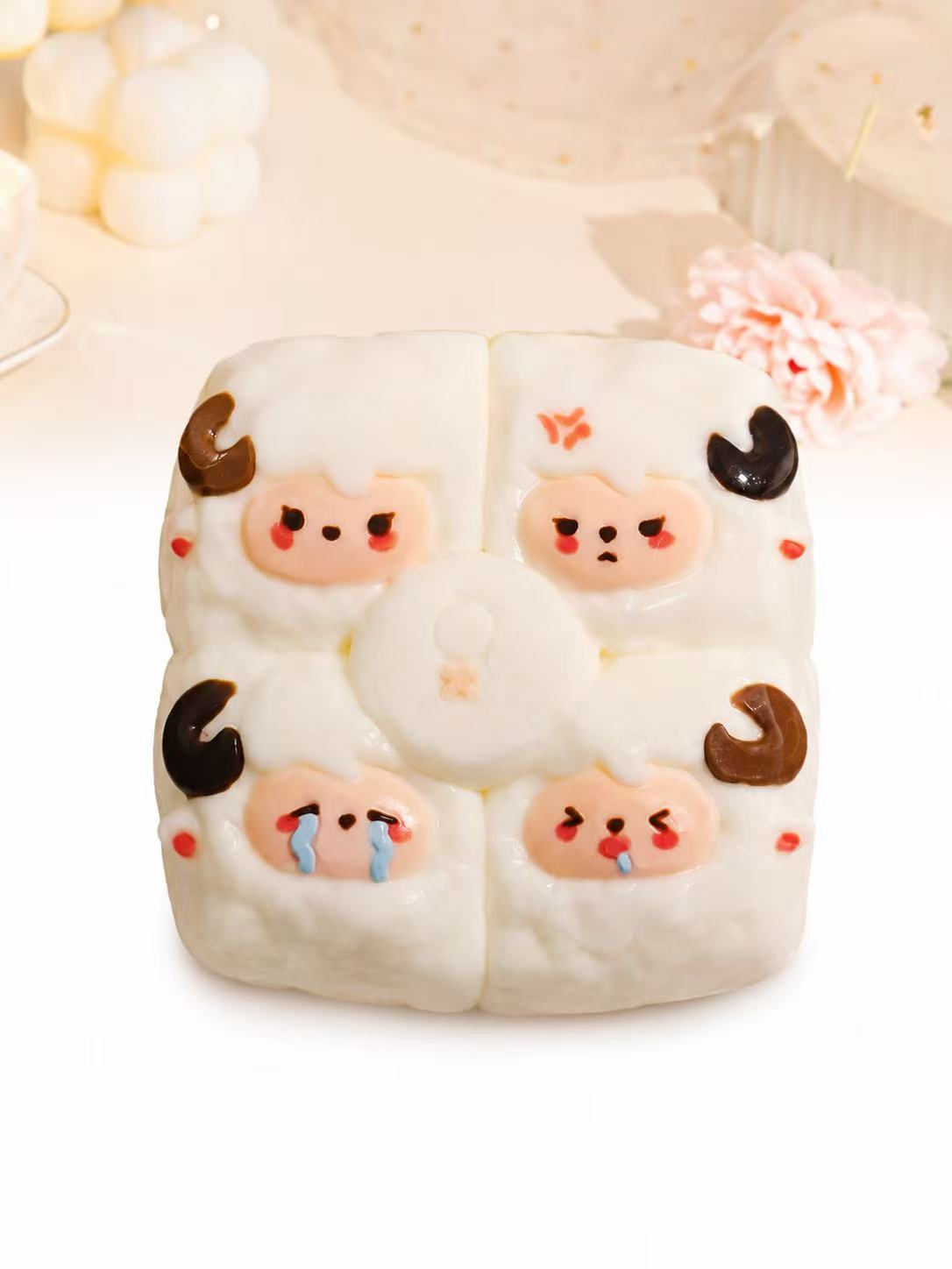 Handmade 4-in-1 Sheep Taba Squishy featuring four sheep faces on a soft white silicone design