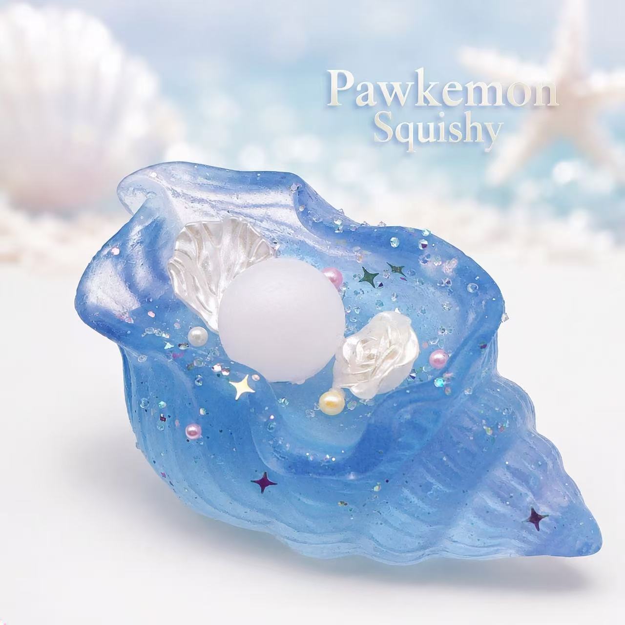 Blue shell-shaped squishy toy with white center and star decorations on a light blue background.