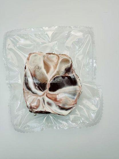 Back view of the handmade Chocolate Toast Taba Squishy showing intricate swirl details and soft texture, wrapped in transparent packaging.