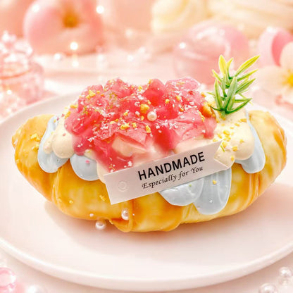 taba-squishy-pawkemon-squishy.jpg
Dreamy Peach Croissant Taba Squishy by Pawkemon Squishy, a handmade silicone croissant squishy with peach cream, pink topping, and soft dessert details.