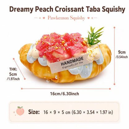 ize chart for Dreamy Peach Croissant Taba Squishy, handmade silicone dessert squishy measuring about 16 x 9 x 5 cm.
