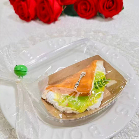 Alt Text
Handmade muscat grape dessert squishy with cream and glaze, topped with a silver fork charm and greenery, packaged in a clear pouch with ribbon and green bell.