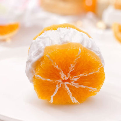Orange slices Taba Squishy with white cream on a white background