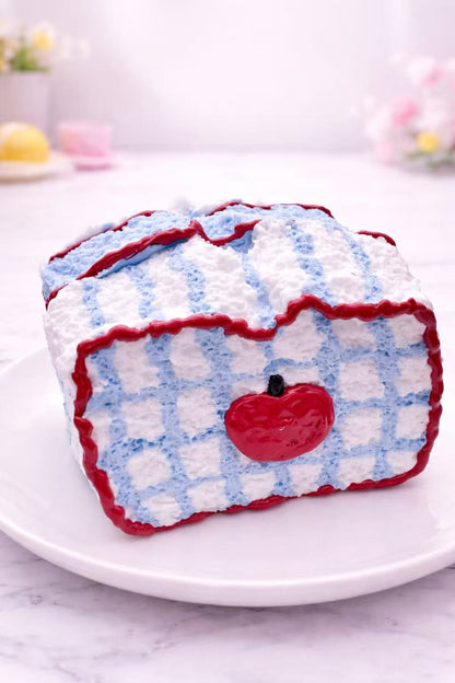 Apple toast taba squishy with blue checkered pattern, handmade realistic silicone squishy, soft and slow rising texture