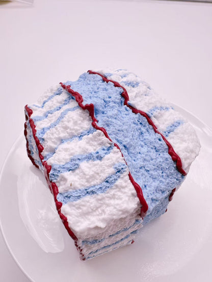 Side view of apple toast taba squishy with blue checkered texture, handmade realistic silicone squishy, soft slow rise toy