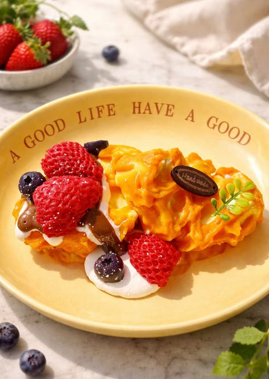 Berry Blossom Waffle Taba Squishy with strawberry and blueberry toppings, handmade silicone dessert squishy with creamy texture and realistic details, displayed on a yellow plate 
