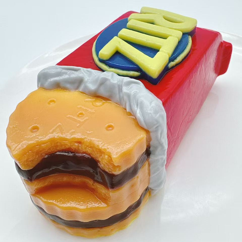 Buttery cracker bite taba squishy showing creamy filling layers, handmade silicone sensory toy with ultra realistic food texture