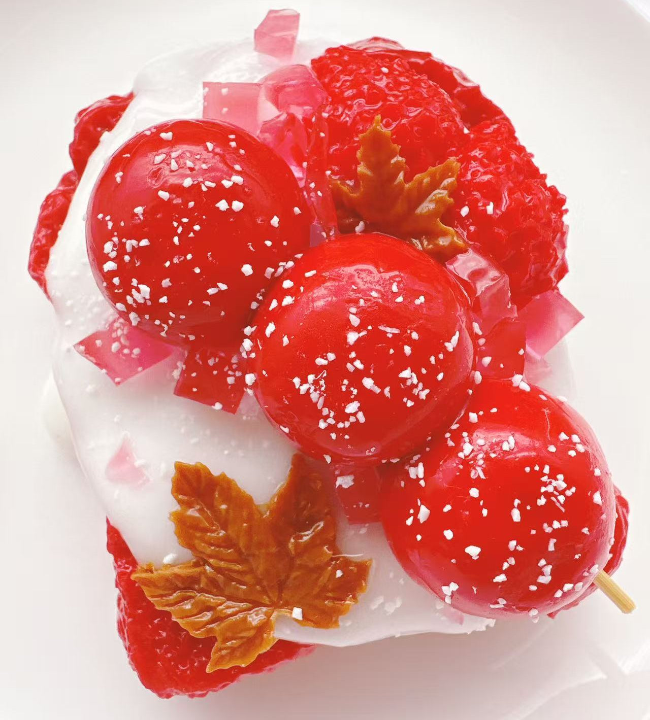 Angled view of Candy Apple Strawberry Toast taba squishy highlighting glossy candy apple coating, creamy topping and detailed handmade silicone texture
