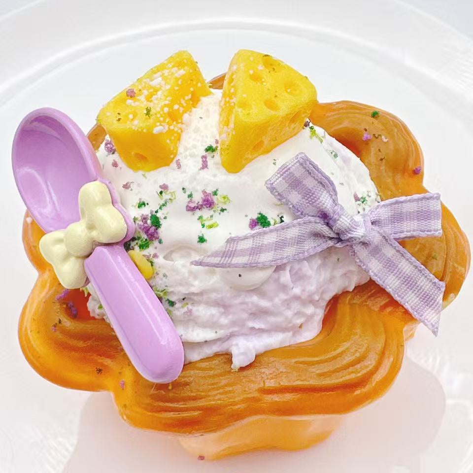 Handmade cheese ice cream cream tart taba squishy with creamy whipped topping, golden tart crust, ribbon decoration and realistic silicone dessert details, luxury stress relief toy