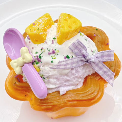 Handmade cheese ice cream cream tart taba squishy with creamy whipped topping, golden tart crust, ribbon decoration and realistic silicone dessert details, luxury stress relief toy