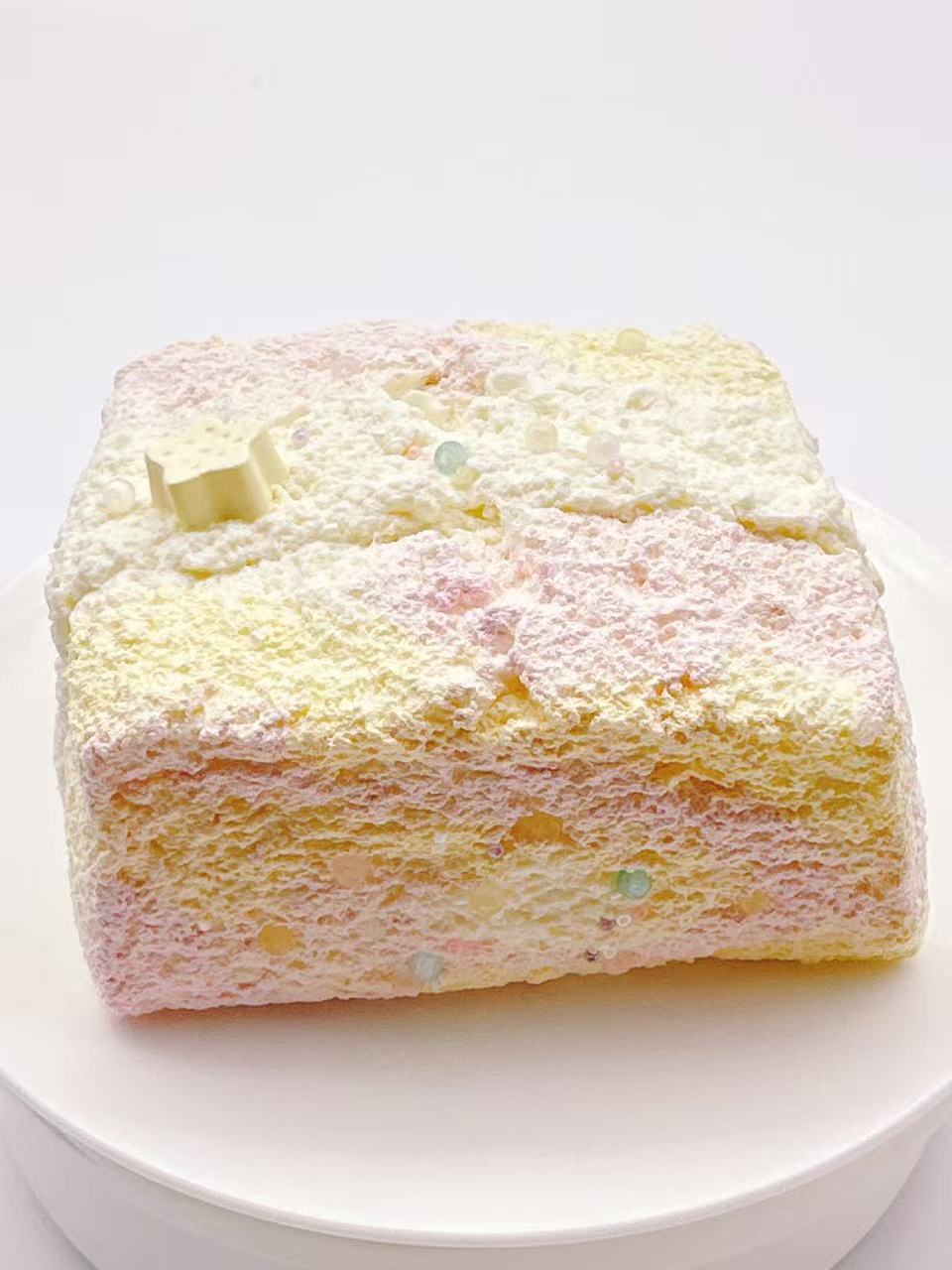 Side view of cheese toast taba squishy with layered cream texture, handmade silicone squishy, soft slow rising stress relief toy