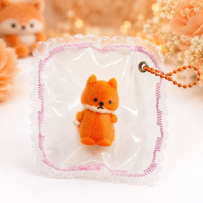 Cute Fox Taba Squishy in an absolutely clear PVC pouch with pink stitched border and orange bead chain, displayed as a handmade stress relief toy.