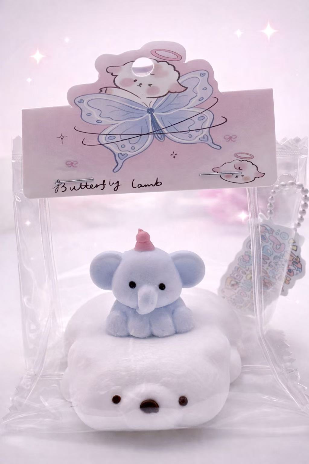 Handmade Elephant on Polar Bear taba squishy with a baby elephant sitting on a soft white polar bear base, cute pastel design, clean e-commerce product photo