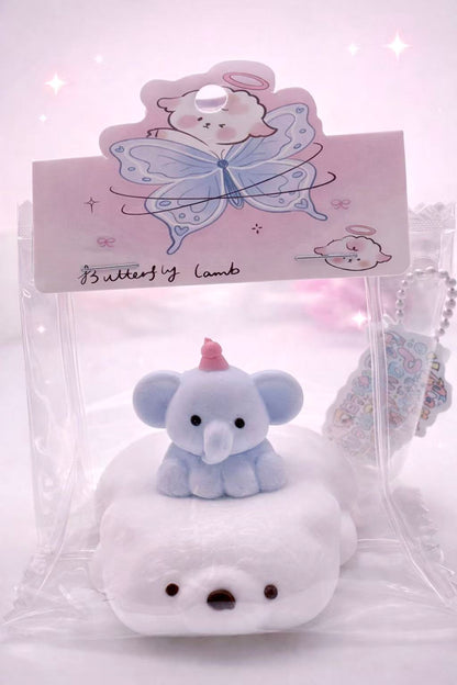 Handmade Elephant on Polar Bear taba squishy with a baby elephant sitting on a soft white polar bear base, cute pastel design, clean e-commerce product photo