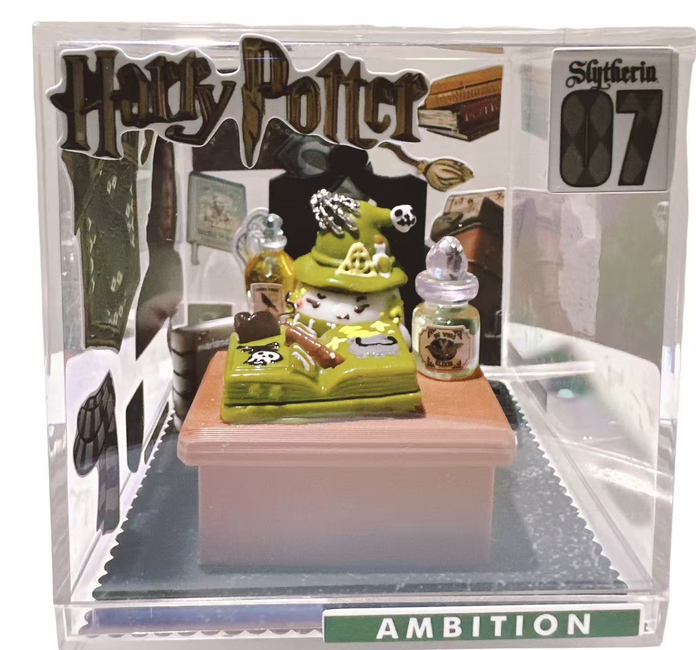 Evil Wizard Taba Squishy displayed in a clear acrylic box with dark magic alchemy desk scene, handmade silicone collectible squishy