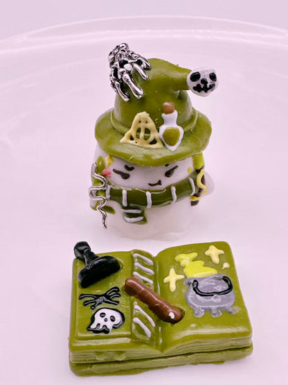 Front view of Evil Wizard Taba Squishy showing wizard figure, spell book and alchemy details, handmade silicone squishy