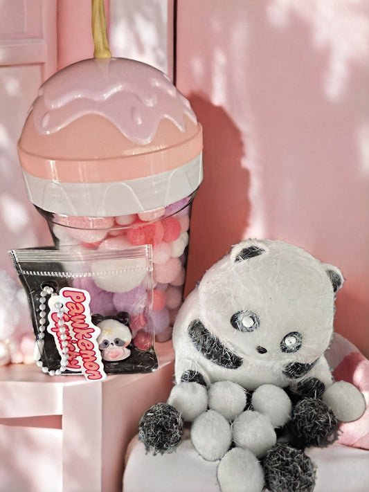 Adorable flocked cute panda squishy toy displayed with ice cream-themed backdrop, featuring soft fuzzy texture and kawaii panda design for collectors.