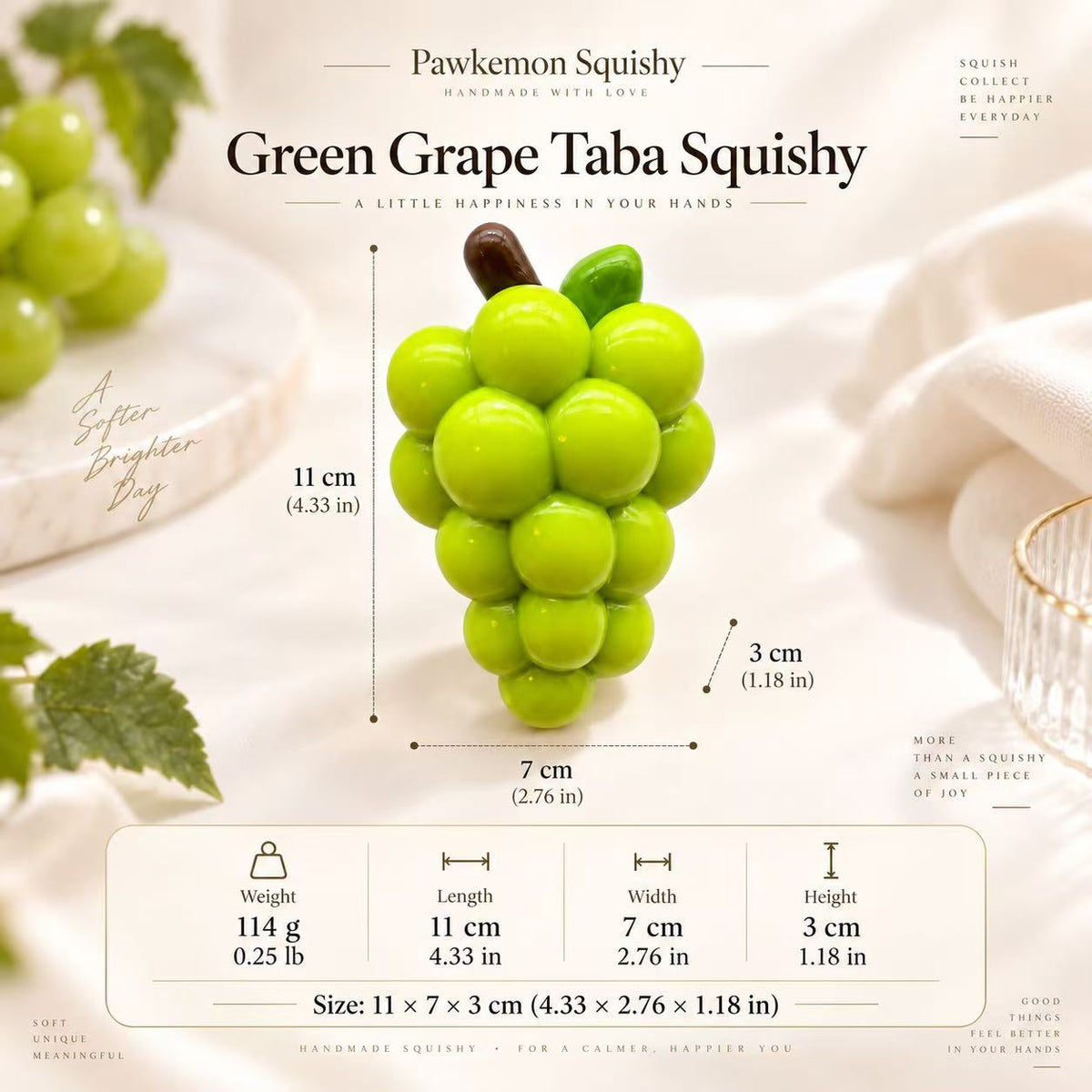 Green Grape Taba Squishy size guide showing approximate dimensions of 11 × 7 × 3 cm and a weight of 114 g for the handmade silicone fruit fidget.