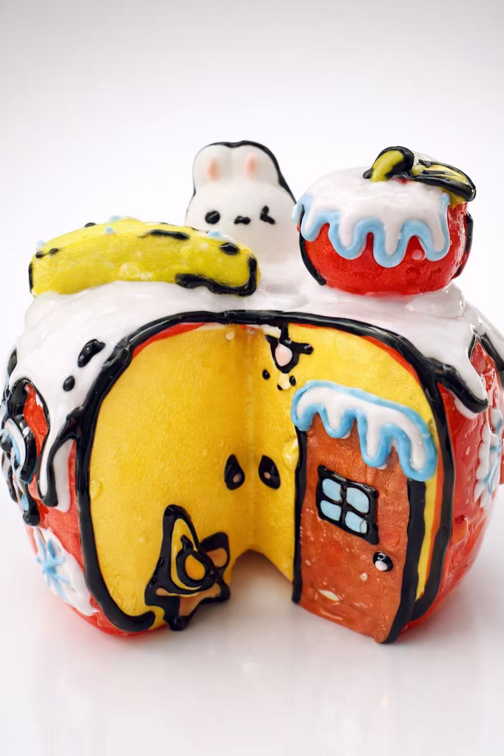 Side view of hand-painted bunny apple house taba squishy, handmade anime style silicone squishy with detailed texture
