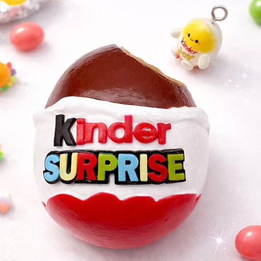 Handmade chocolate egg surprise taba squishy with realistic creamy texture, displayed as a premium stress relief toy on a clean background
