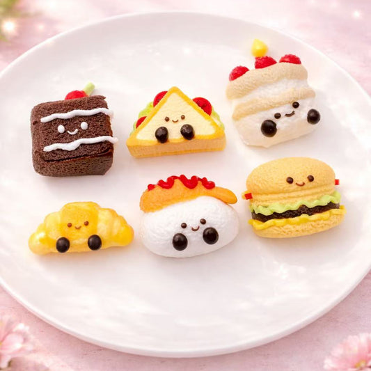 Six mini jellycat inspired food taba squishies including cake, sandwich, croissant, shrimp tempura, burger and birthday cake displayed together.