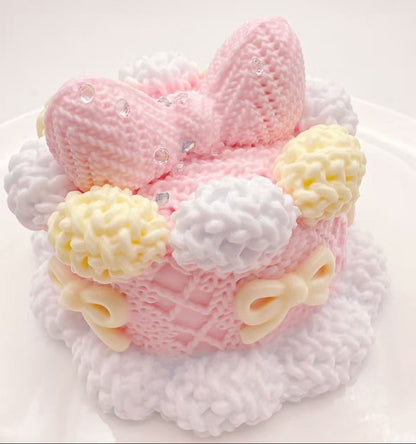 Handmade Knitted Bunny Bow Cake Taba Squishy featuring detailed knit-style cake design with bunny ears and creamy bow accents
