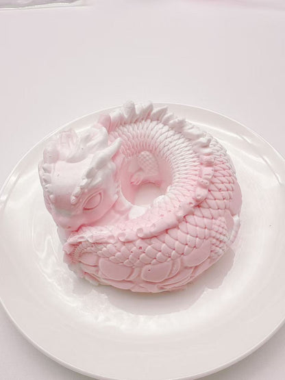 Light pink dragon coil taba squishy made from handmade silicone, fantasy dragon sensory stress toy