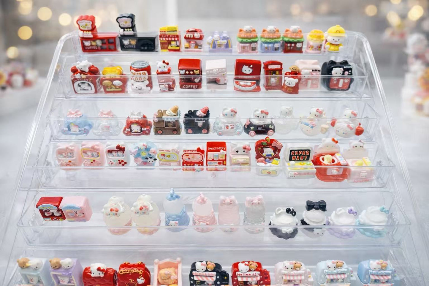 Luxe Mini Taba Squishy Mystery Box featuring a full collection of handmade mini squishies displayed neatly in a clear storage box