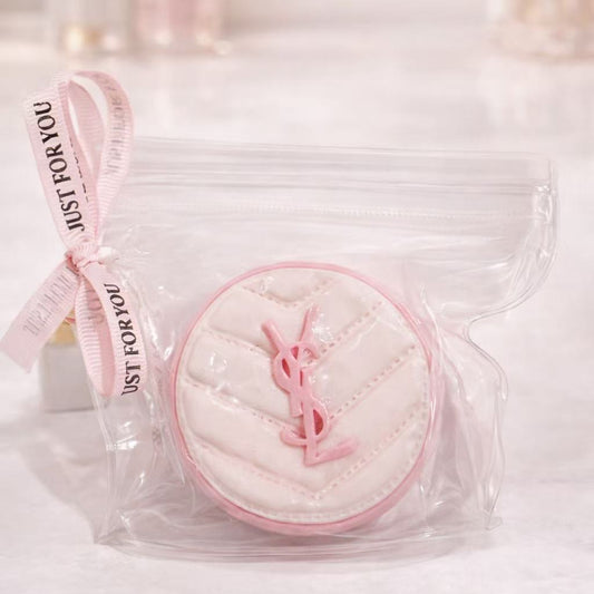Luxury cushion makeup taba squishy in pink and white, packaged in a clear zip pouch with ribbon, shown on a clean white background for product detail display.
