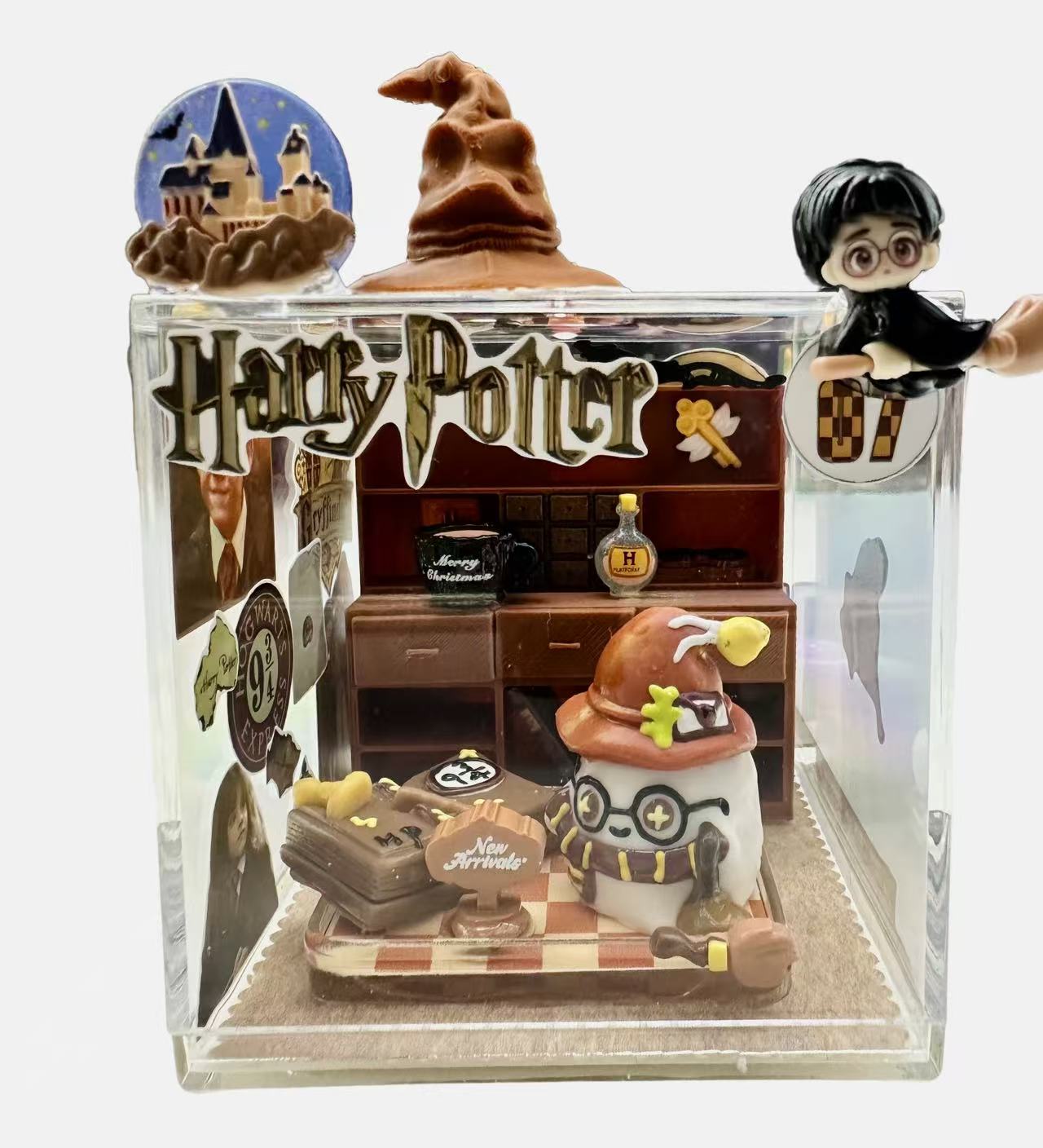 Handmade magic academy case taba squishy in a clear acrylic display box with wizard study scene and miniature details
