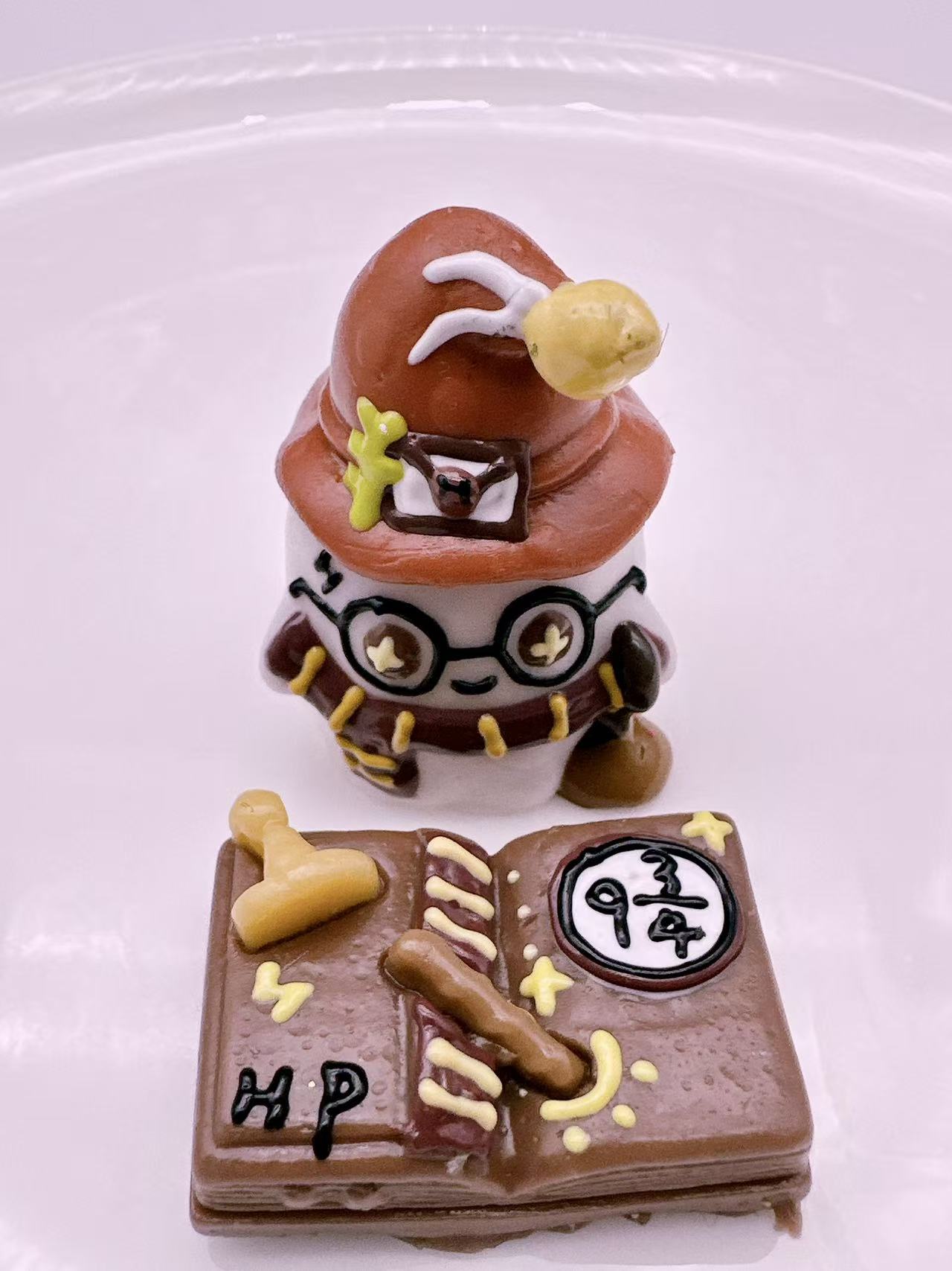Cute wizard character taba squishy inspired by a magic academy theme with detailed handmade silicone texture
