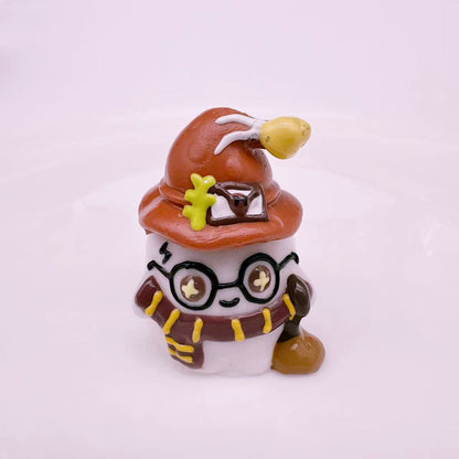 Side view of a handmade magic academy wizard taba squishy showing detailed hat glasses and silicone texture
