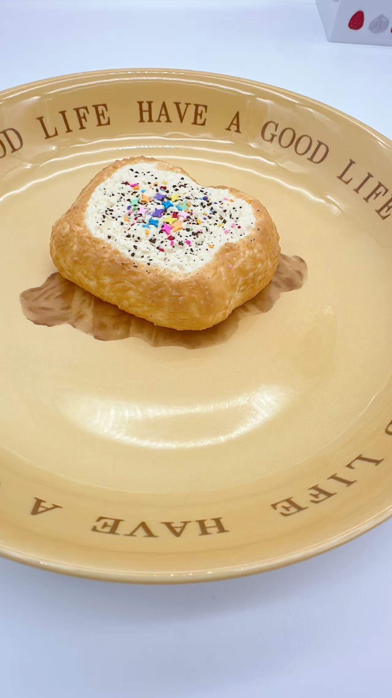 Side view of the Mini Toast Squishy showing the golden crust and cream texture.