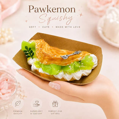 Hand holding the Muscat Delight Taba Squishy, showing its soft handmade silicone texture, green grape dessert design, creamy layers, and collectible size.