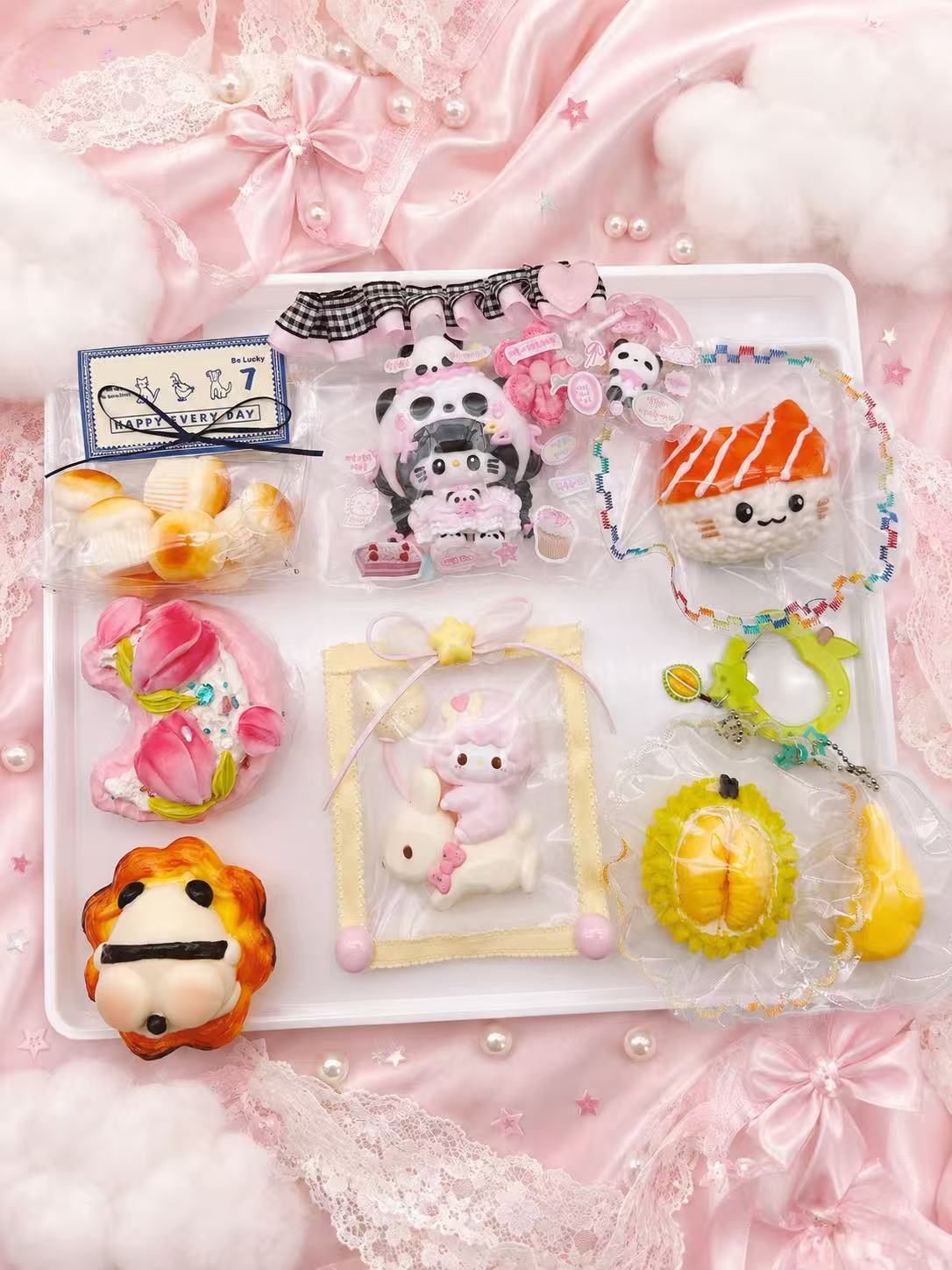 Example assortment for Pawkemon Squishy Blind Bag, showing a variety of handmade taba squishies including food, animal, character, and collectible silicone designs.